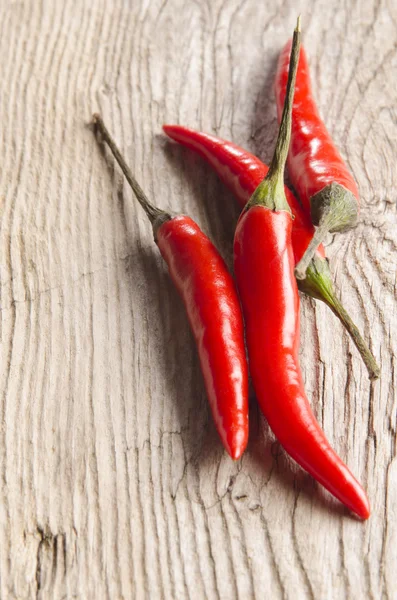 Fresh chili on wooden table Stock Picture