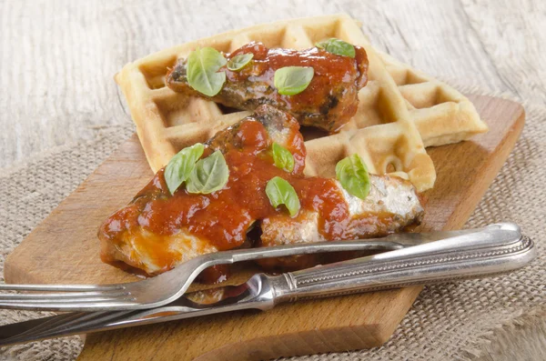 Sardines with tomato sauce and waffle — Stock Photo, Image