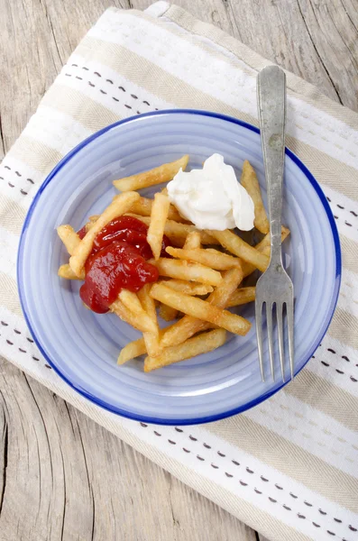 French fries red and white on a plate — Stock Photo, Image