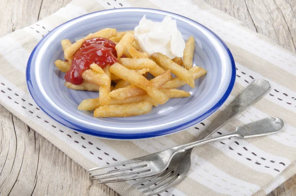 French fries red and white on a plate — Stock Photo, Image