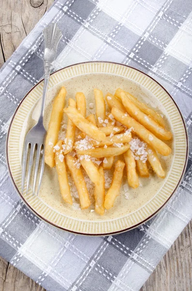 French fries with salt on a plate — Stock Photo, Image