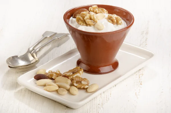 Yogurt with a nut mix — Stock Photo, Image