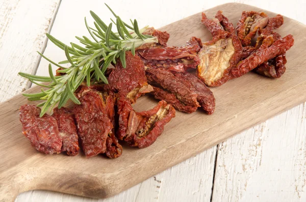 Sun dried tomatoes with rosemary — Stock Photo, Image