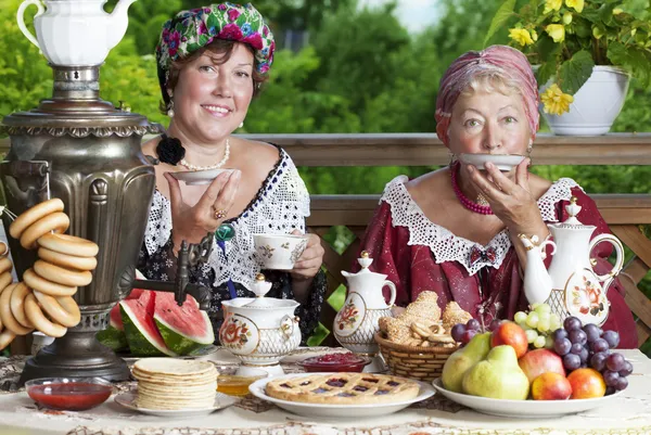 Two women drinking tea