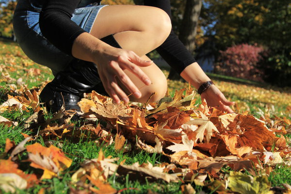 Woman picking leaves