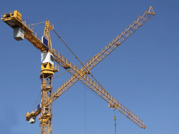 Two cranes with crossed arms — Stock Photo, Image