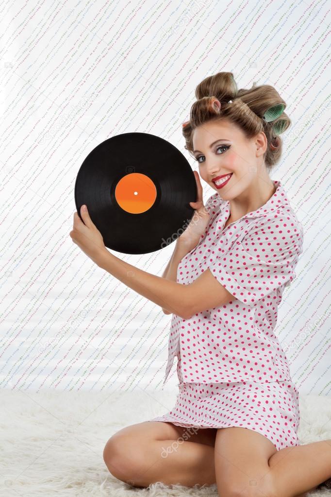 Beautiful Woman Holding Vinyl Record