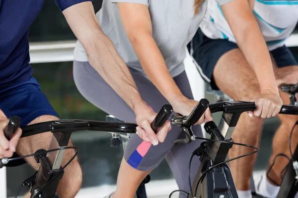 Mid Section Of On Exercise Bikes — Stock Photo, Image
