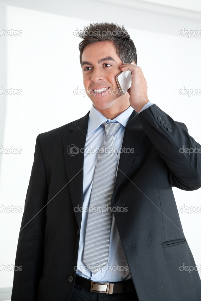 Businessman On Call At Workplace