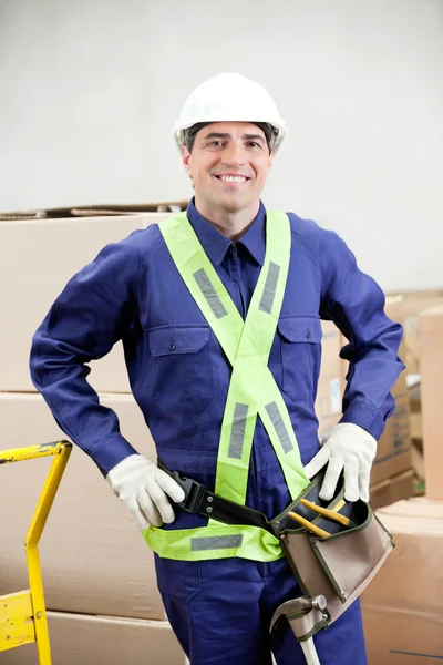 Confident Foreman In Protective Clothing Standing At Warehouse Stock Picture