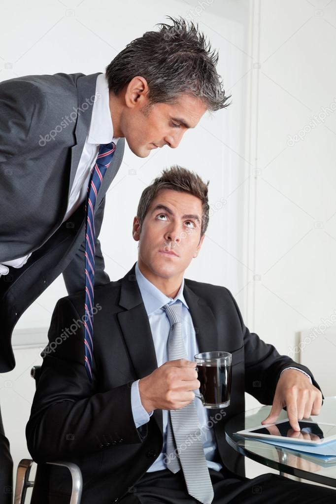 Businessman With Digital Tablet In A Meeting With Colleague