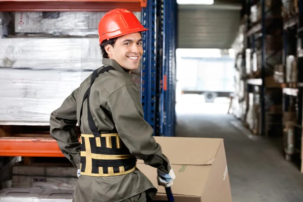 Warehouse Worker Pushing Handtruck With Cardboard Boxes — Stockfoto