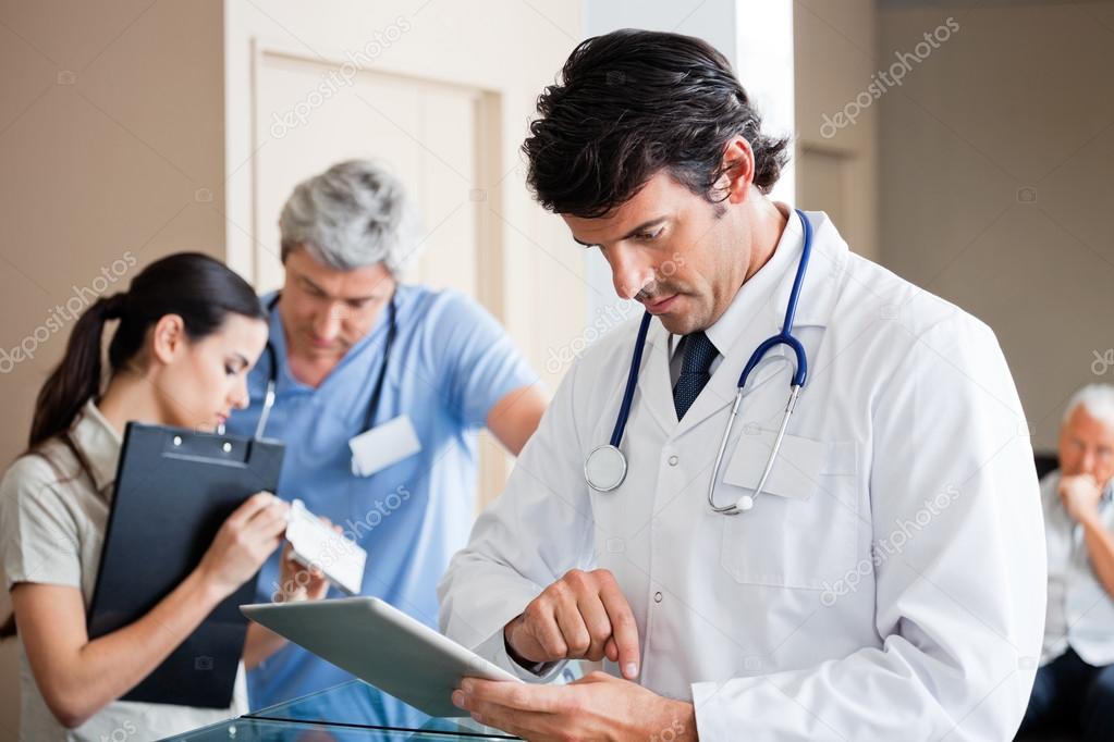 Male Doctor Using Digital Tablet