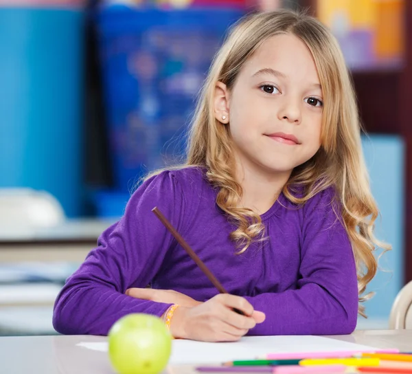 Cute Girl With Sketch Pen And Paper At Desk — Stock Photo, Image