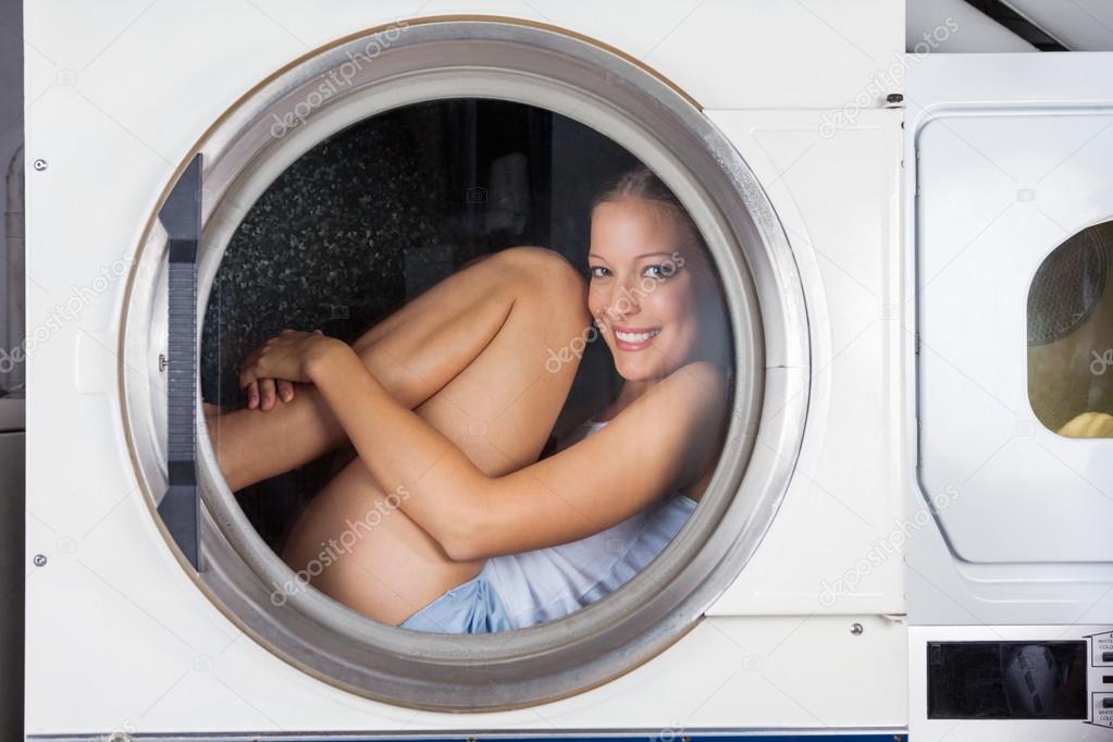 Mischievous Woman Sitting Inside Washing Machine