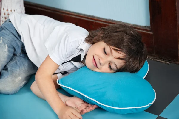 Boy Lying On Heartshaped Pillow In Kindergarten — Stock Photo, Image