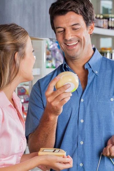 Couple Choosing Cheese At Grocery Store — Stock Photo, Image