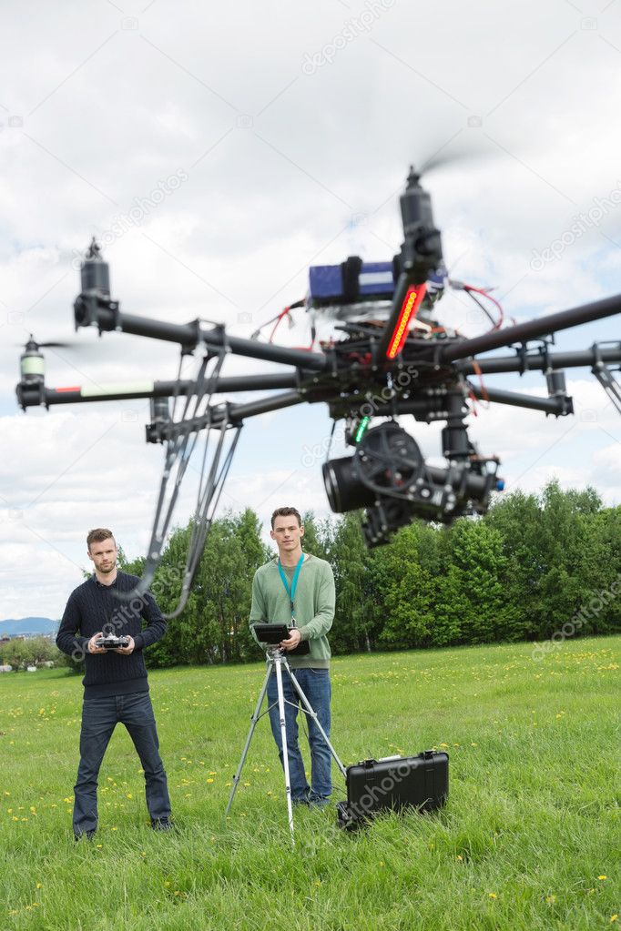 Technicians Flying UAV Spy Drone — Stock Photo © SimpleFoto 31148631