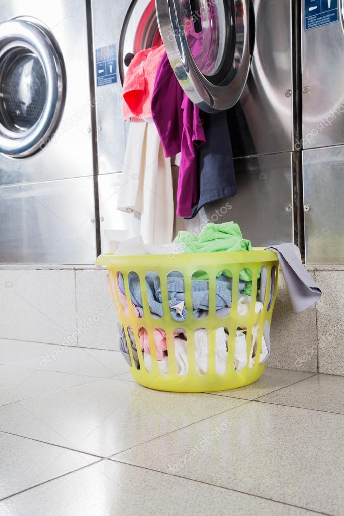 Overloaded Washing Machine And Laundry Basket