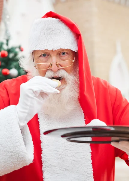 Santa Claus Eating Cookies Outdoors — Stock Photo, Image