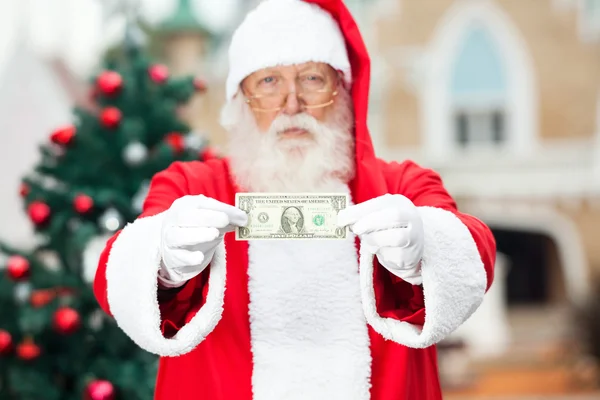 Santa Claus Showing One Dollar Note — Stock Photo, Image