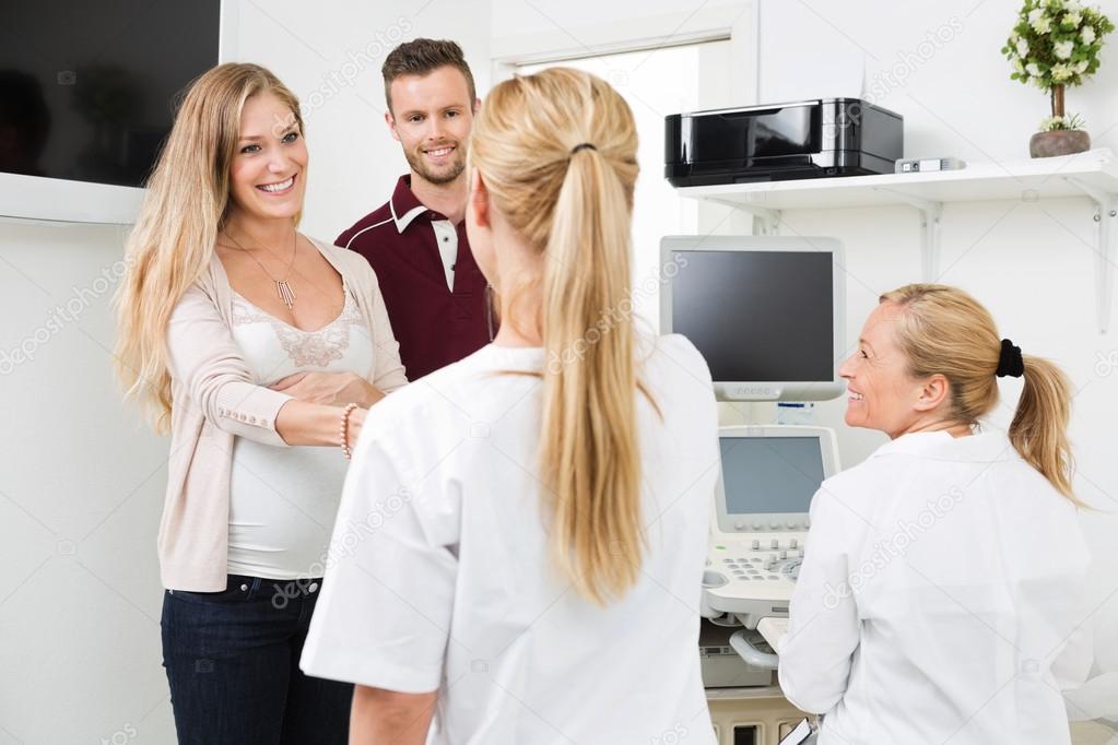 Expectant Couple Visiting Doctor