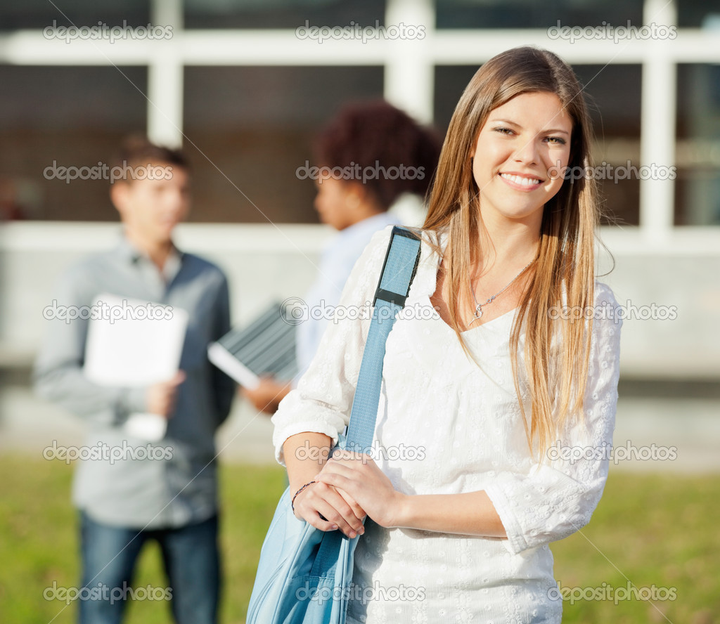 Happy Student Carrying Shoulder Bag Standing On College Campus