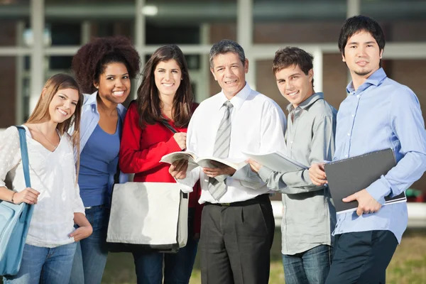 Confident Professor And Students Standing On University Campus — Stock Photo, Image