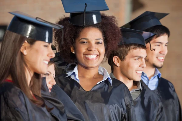 Woman With Friends On Graduation Day At College Royalty Free Stock Images
