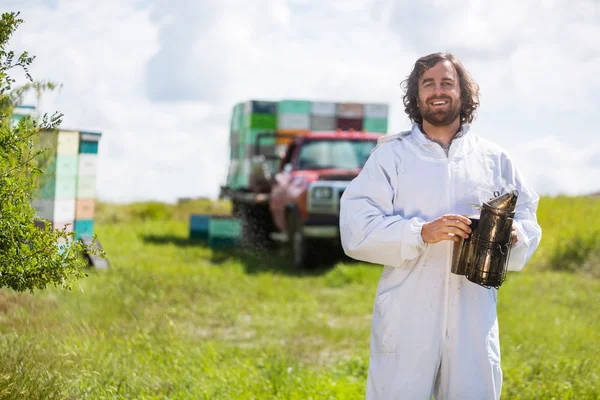 Beekeeper In Holding Smoker At Apiary — Stock Photo, Image