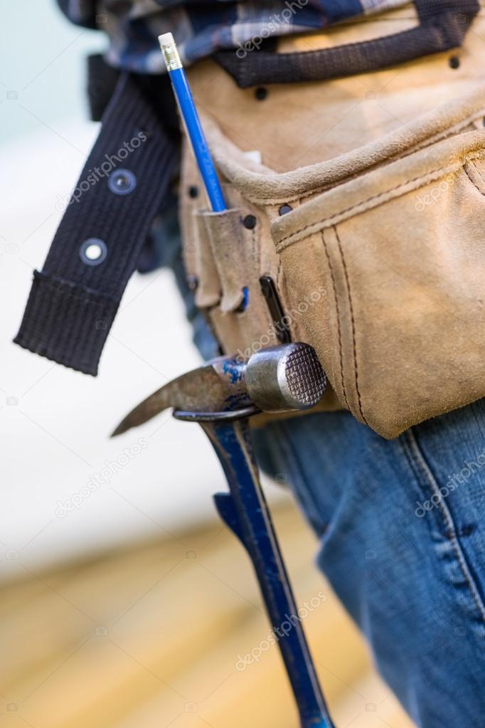 Hammer Hanging In Tool Belt Of Carpenter — Stock Photo © SimpleFoto 34167841