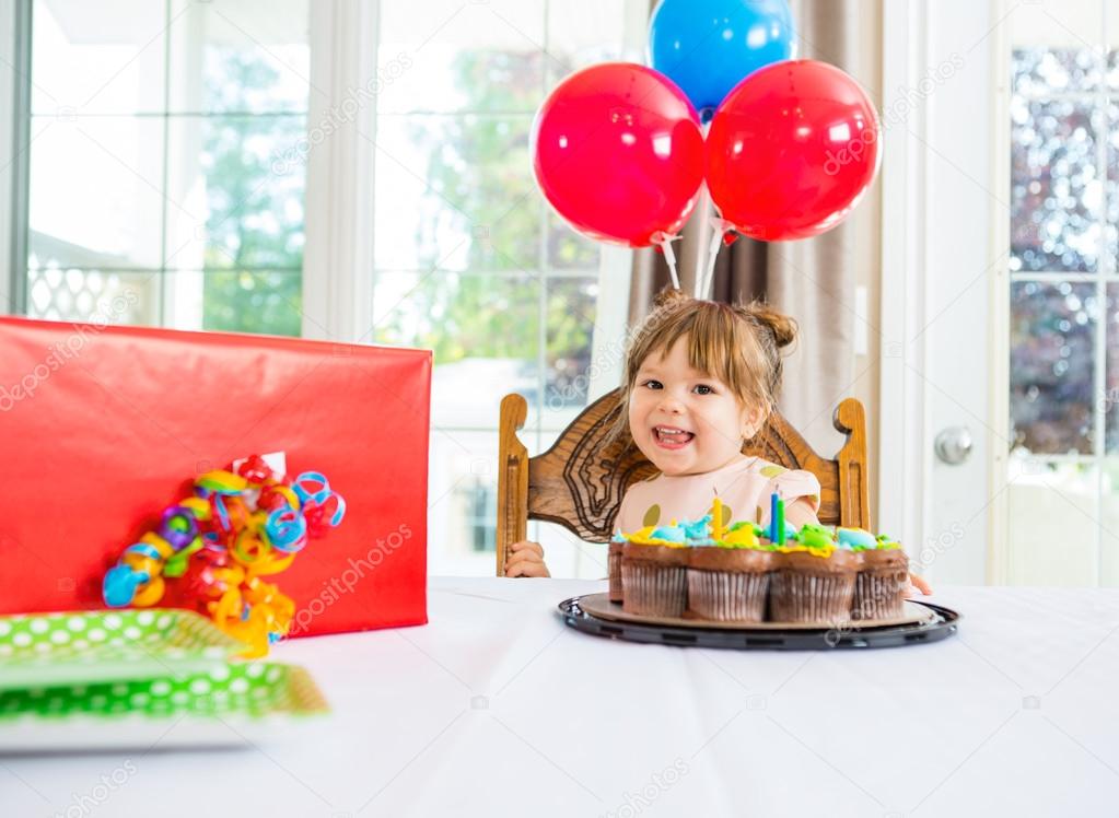 Birthday Girl With Cake And Present On Table