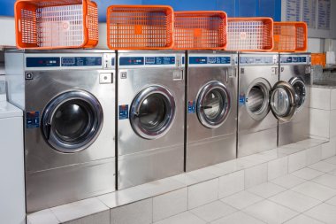 Washing Machines And Empty Baskets In A Row clipart