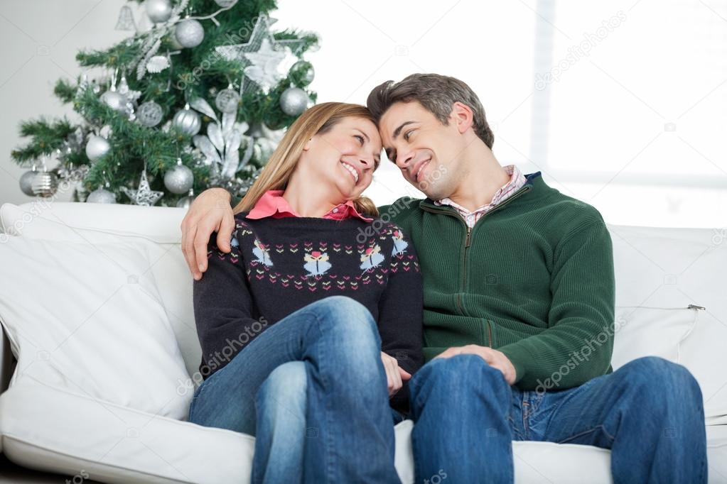 Romantic Couple Looking At Each Other During Christmas