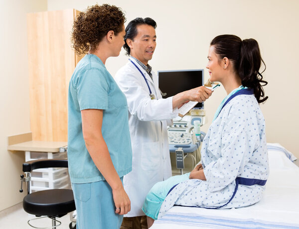 Doctor Examining Patient In Ultrasound Room