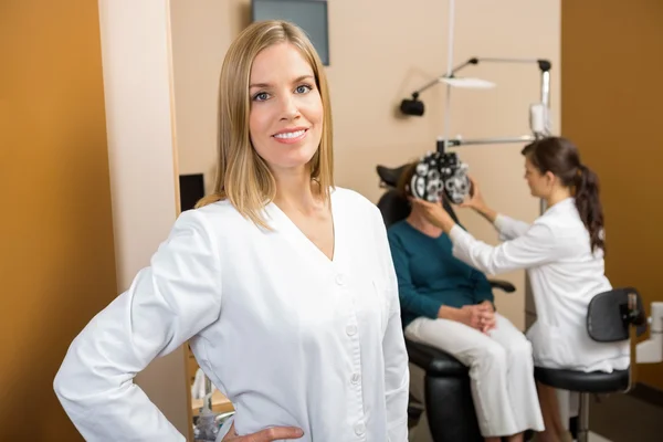 Eye Doctor With Colleague Examining Patient — Stock Photo, Image