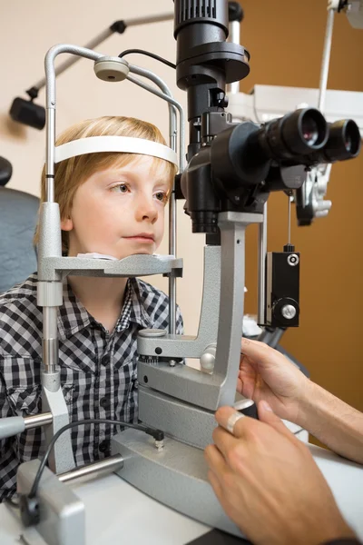 Boy Having His Eyes Examined With Slit Lamp By Doctor Stock Image