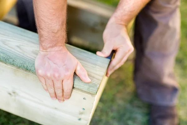 Manual Worker's Hand Fixing Wood At Site — Stock Photo, Image