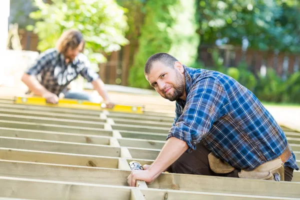 Carpenter Working At Construction Site — Stock Photo, Image