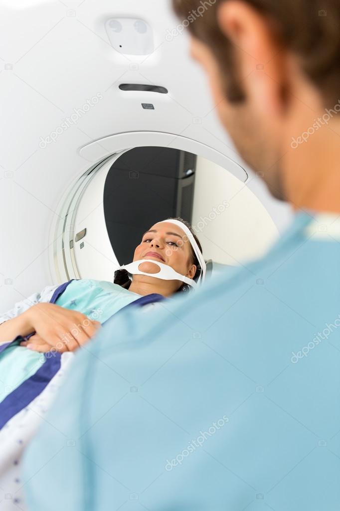 Patient Looking At Nurse While Undergoing CT Scan