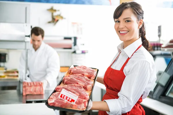 Happy Butcher Holding Meat Tray In Store — Stock Photo, Image