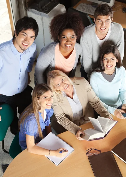 Teacher And Students With Books Smiling In Classroom — Stock Photo, Image