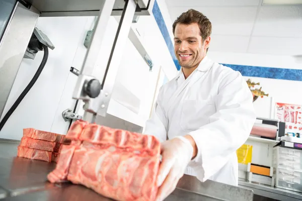 Butcher Cutting Meat On Bandsaw — Stock Photo, Image