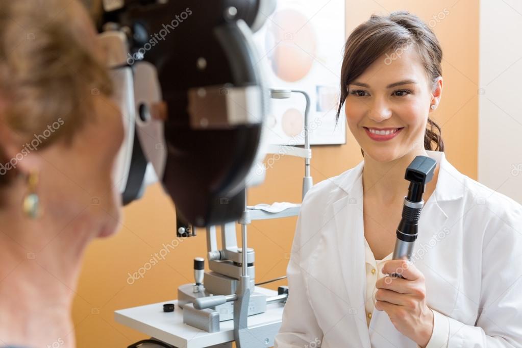 Optometrist Examining Senior Woman's Eyes