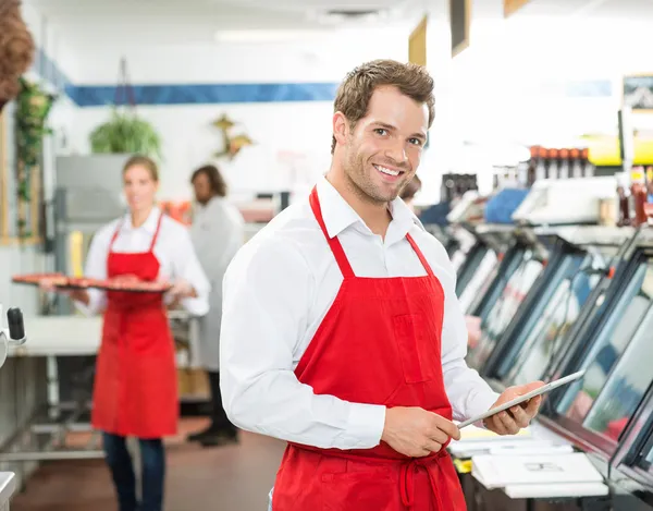 Portrait Of Happy Butcher Holding Digital Tablet At Store — Stock Photo, Image