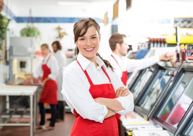 Confident Female Butcher Standing Arms Crossed clipart