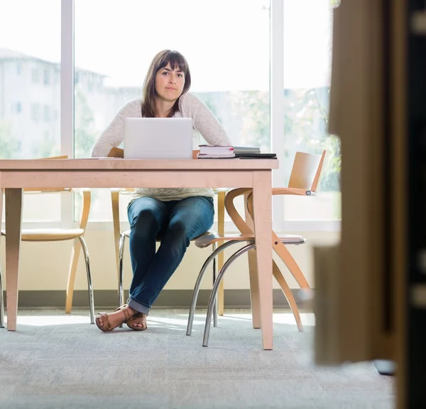 Portrait Of Student Sitting In Library — Stock Photo, Image