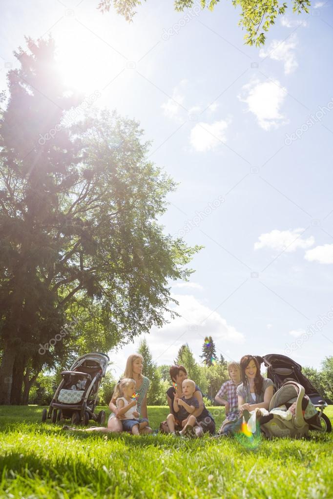 Mothers And Children Spending Quality Time In Park