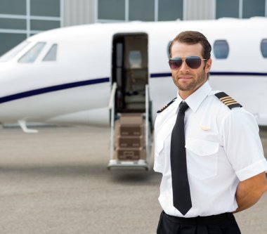 Confident Pilot Wearing Sunglasses clipart