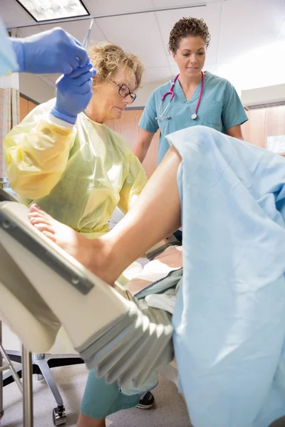 Surgeon Receiving Scissors From Colleague While Delivering Baby — Stock Photo, Image